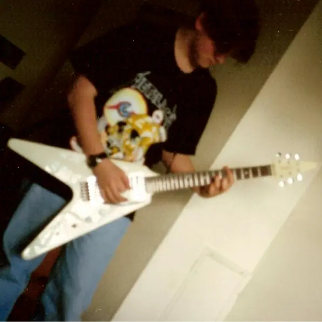 Tom as a youngster with his guitar